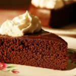 slice of chocolate diet coke cake with whipped topping
