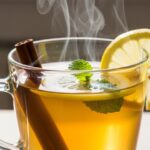 Steaming Costa Rican tea in mug with cinnamon and mint