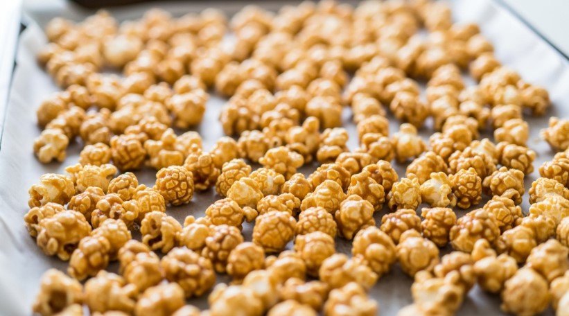 easy caramel popcorn recipe on baking sheet