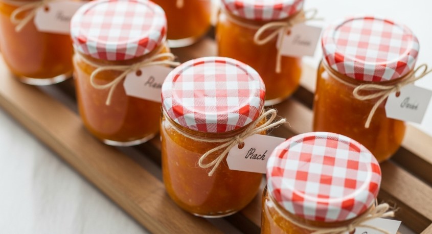 cooling jars of homemade peach jam